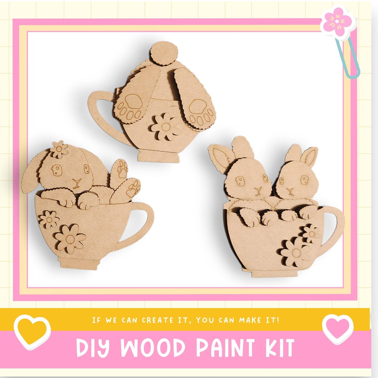 three wooden cutouts of rabbits in cups, arranged in a row.