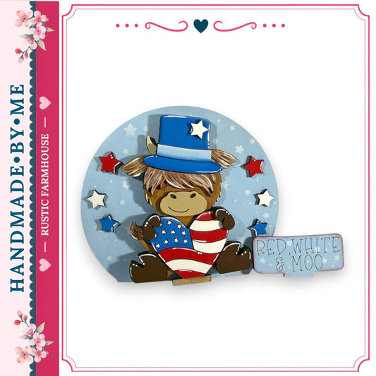 A wooden cutout of a horse wearing a top hat and holding an American flag, surrounded by stars and flowers, with a sign that says "RED WHITE & MOO".