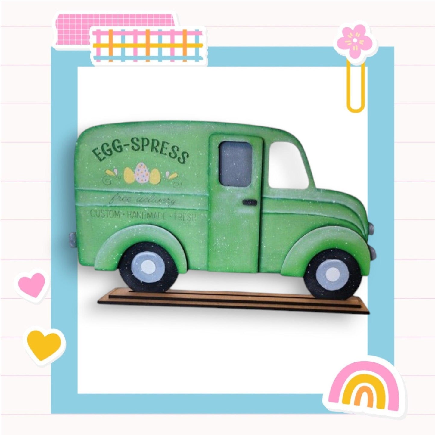a green toy truck with a rainbow in the background