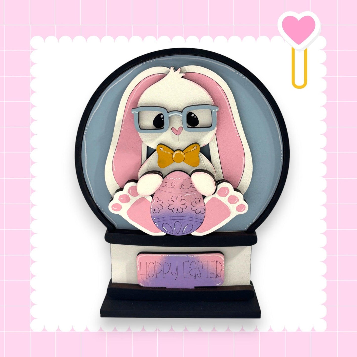 a paper sculpture of a bunny with glasses and a bow tie
