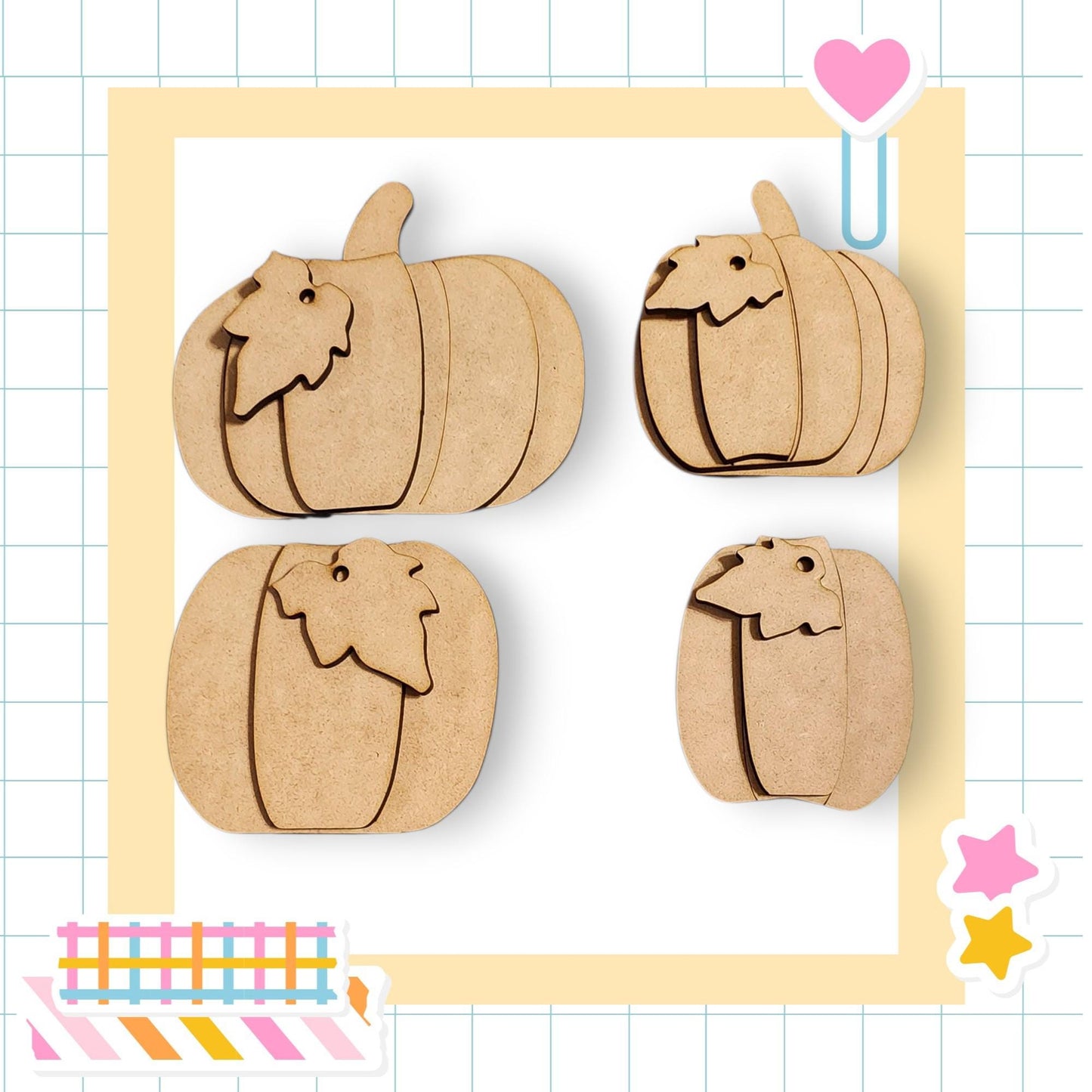 four wooden pumpkins arranged in a square frame, with a heart and stars decorating the border.