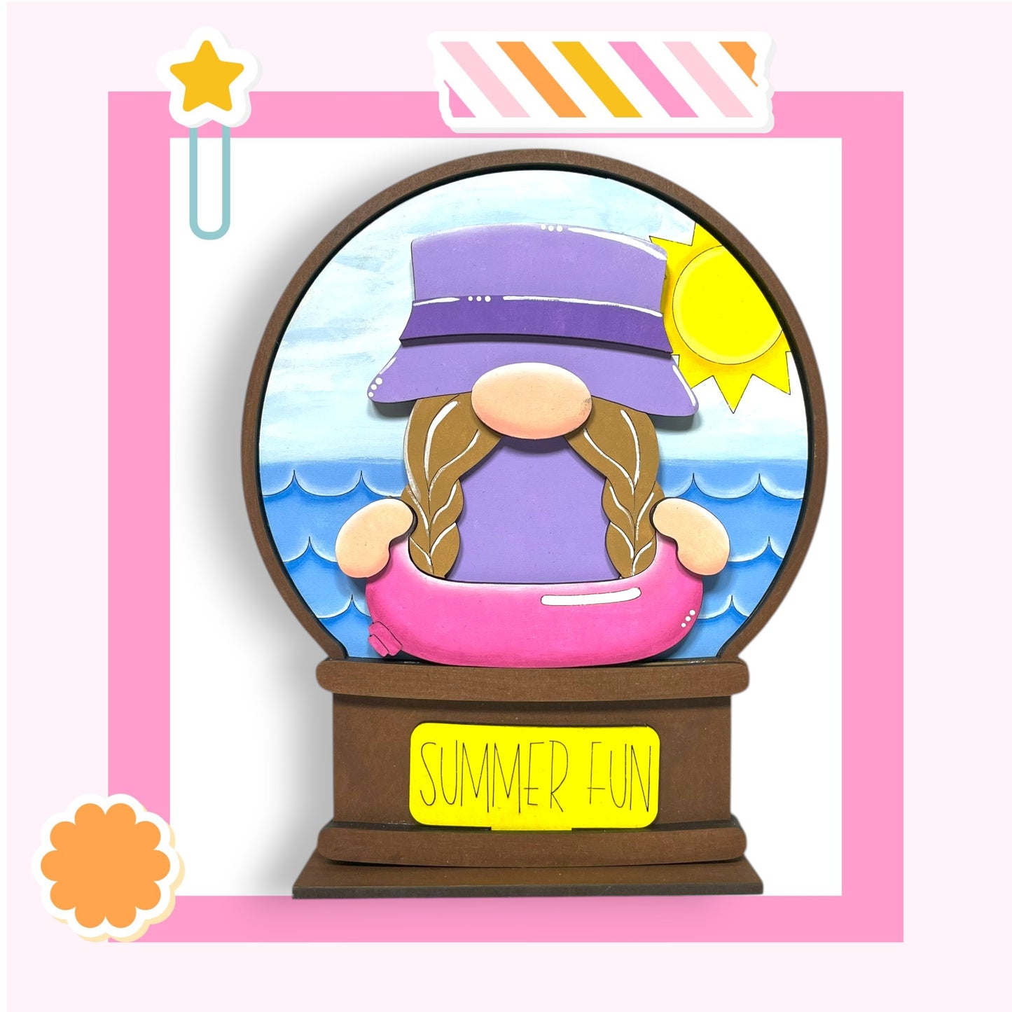A whimsical illustration of a gnome wearing a purple hat and sitting in a pink inflatable pool, with a "Summer Fun" sign below the gnome.