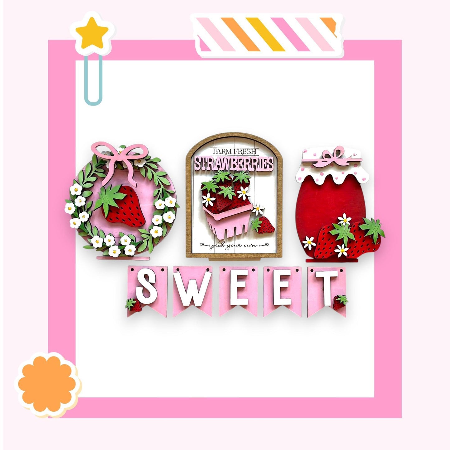 a pink frame with a picture of a strawberry