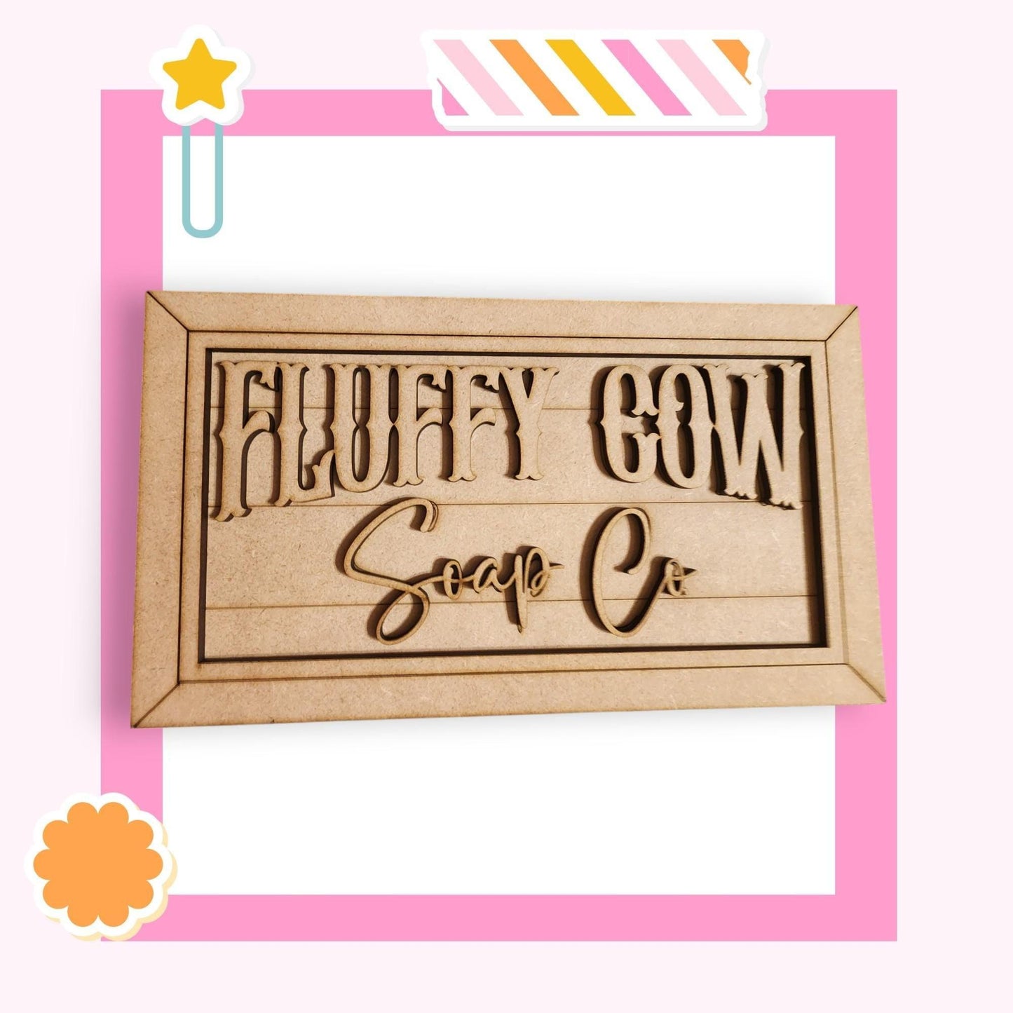 a wooden sign with the words sorry cow soap on it
