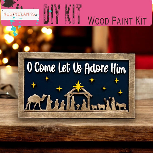 a wooden sign with a nativity scene on it