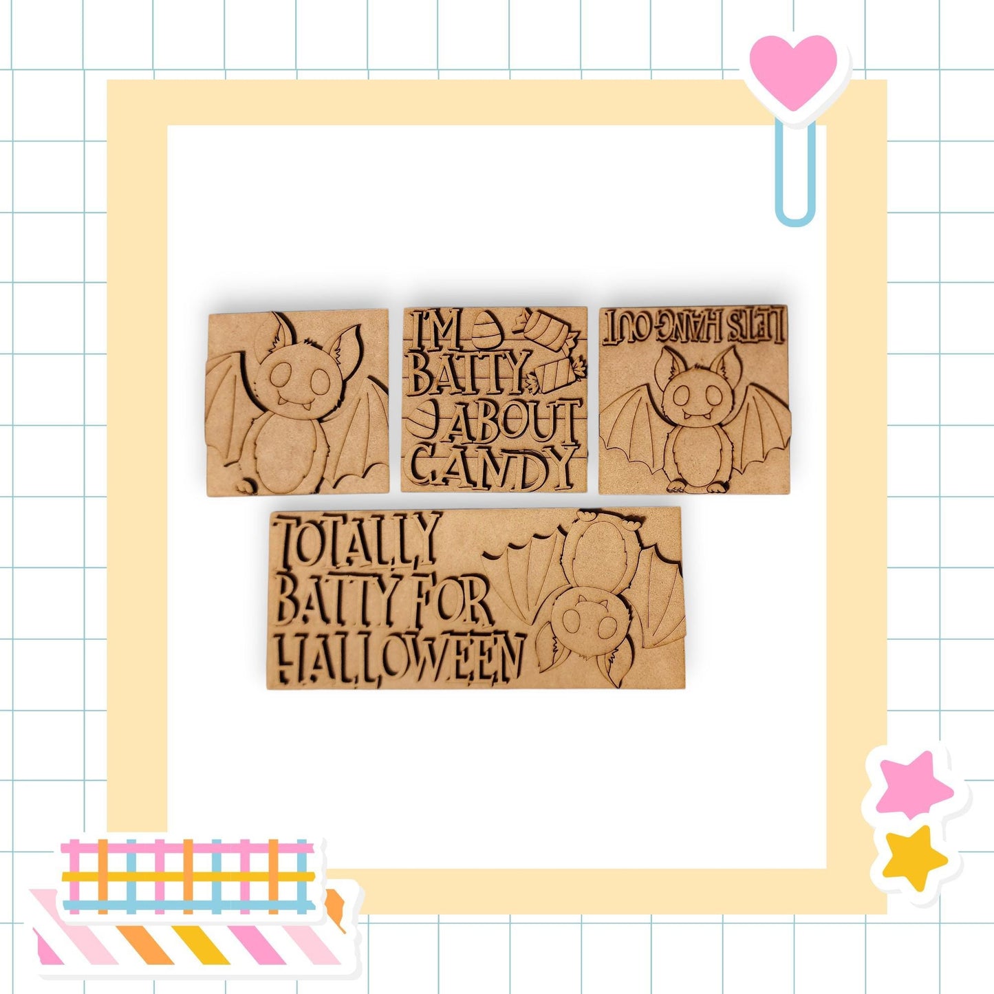 three wooden blocks with bat-like designs, each with a different message written on it. The blocks are arranged in a square frame, and there are various stickers and decorative elements surrounding the frame.
