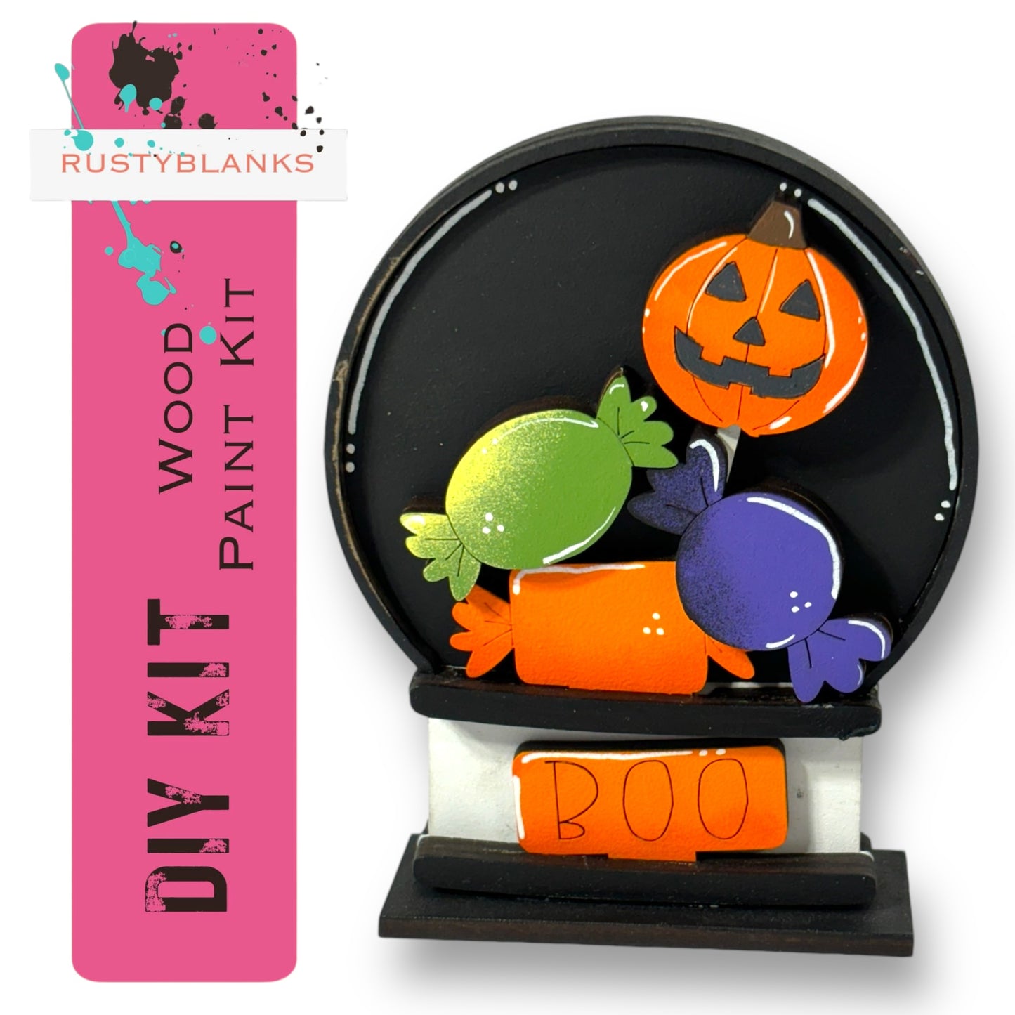 a DIY kit for a Halloween-themed wood paint project, including a carved pumpkin and candy pieces.