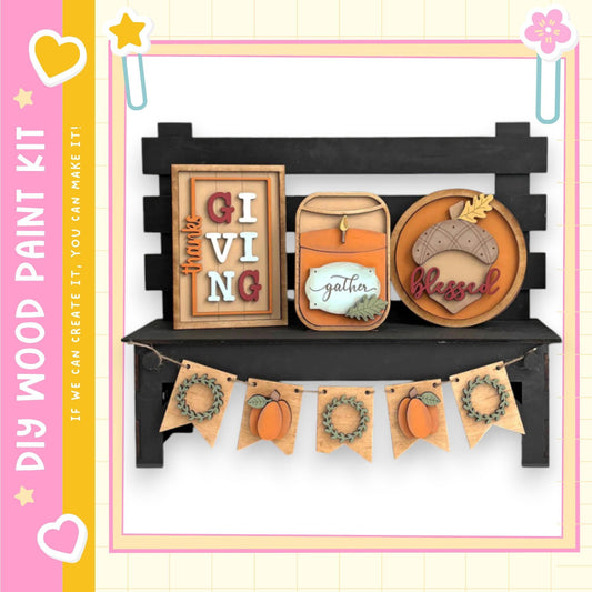 a wooden bench with various fall-themed decorations and signs attached to it.