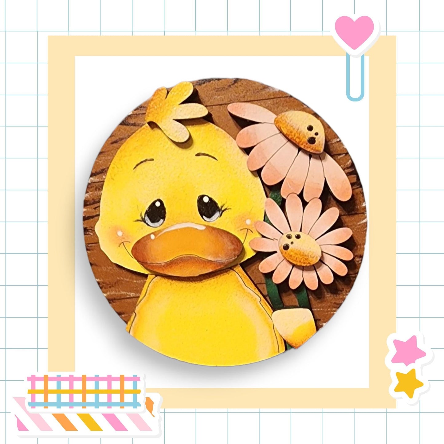 a picture of a yellow duck with flowers