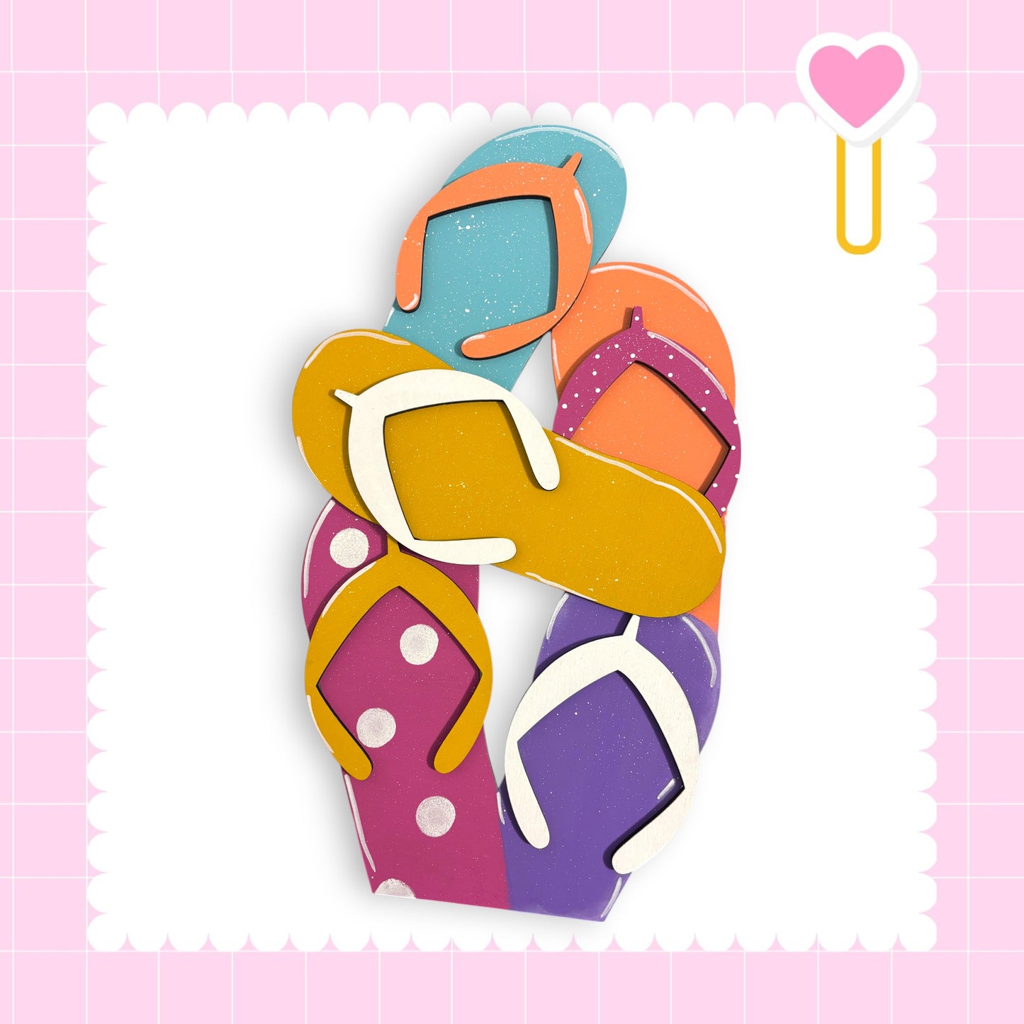 A colorful arrangement of various flip-flop-style footwear, including yellow, orange, pink, purple, and white polka dot designs, against a pink background with a heart-shaped sticker.