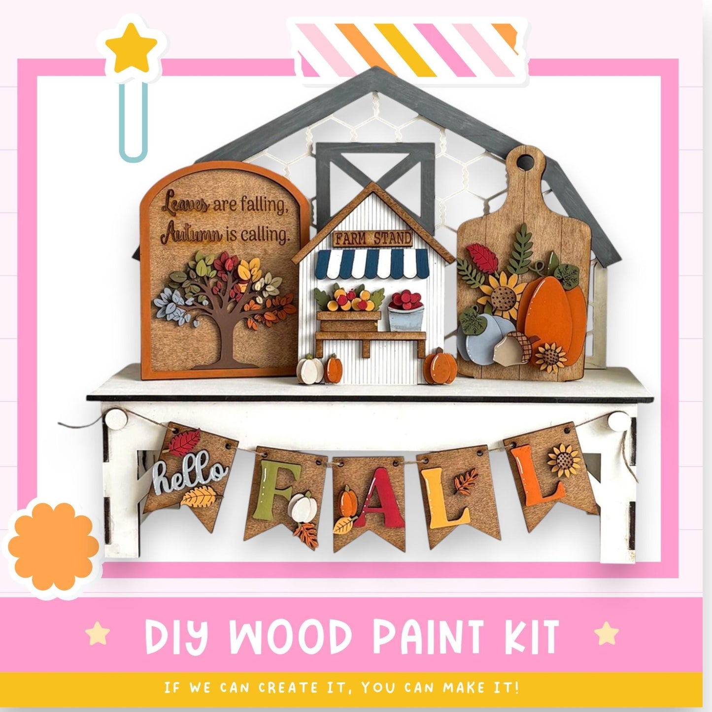 The image is a colorful and festive DIY wood paint kit for creating a fall-themed display. It includes a wooden house, a sign, and a banner that says "Hello Fall". The kit appears to be made of wood and is designed to be assembled and painted to create a seasonal decoration.