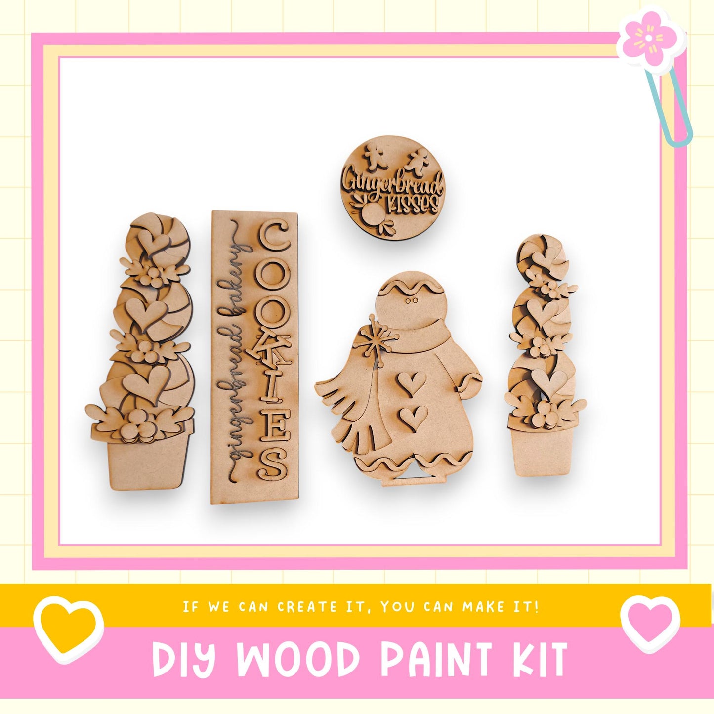 a DIY wood paint kit with various wooden shapes and designs, including a cookie cutout, a snowman, and a tree. The kit appears to be made of wood and is displayed against a white background.