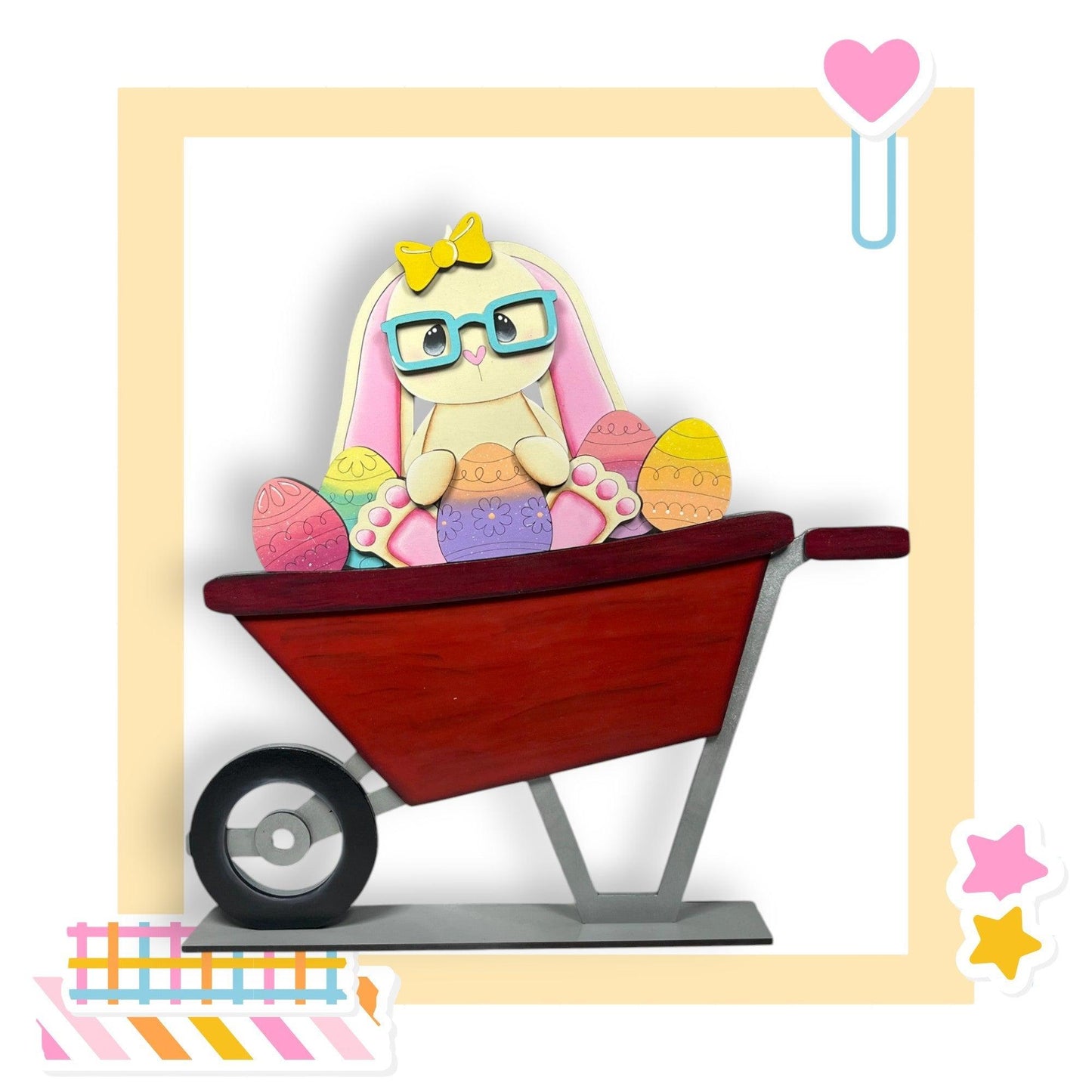 a picture of a doll in a wheelbarrow