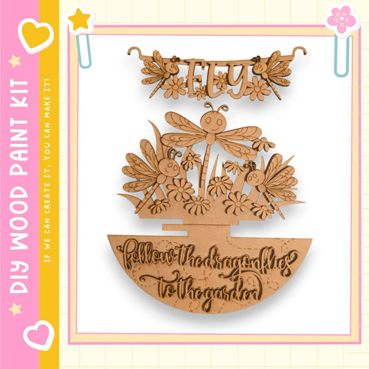 The image is a wooden craft kit featuring a dragonfly and flower design.