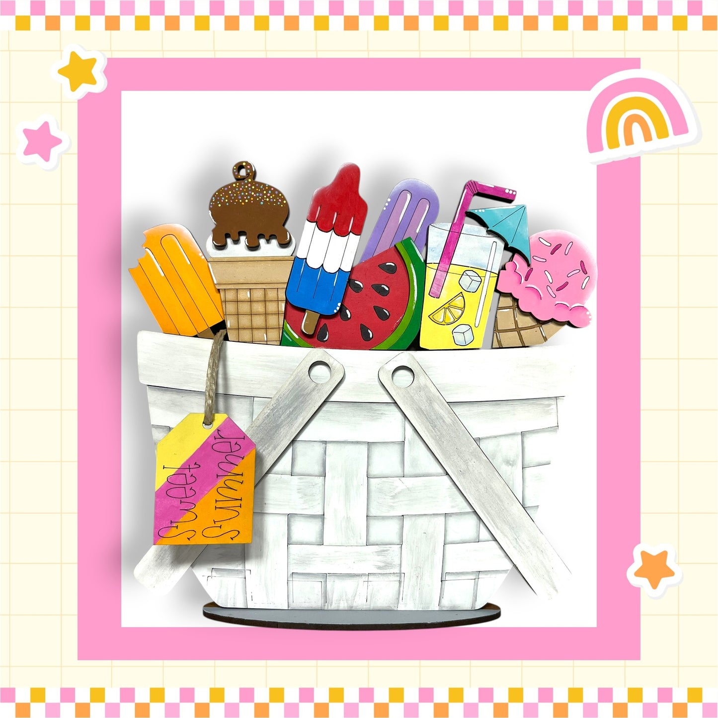 A basket filled with various colorful and whimsical summer-themed objects, including popsicles, ice cream, and a rainbow, set against a pink and yellow checkered background.