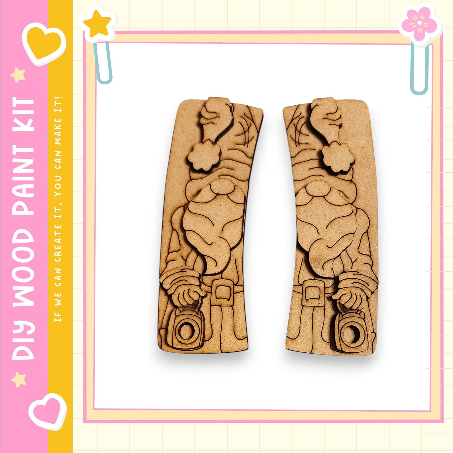 two wooden cutouts of a gnome holding a camera, set against a pink and yellow background with decorative elements.