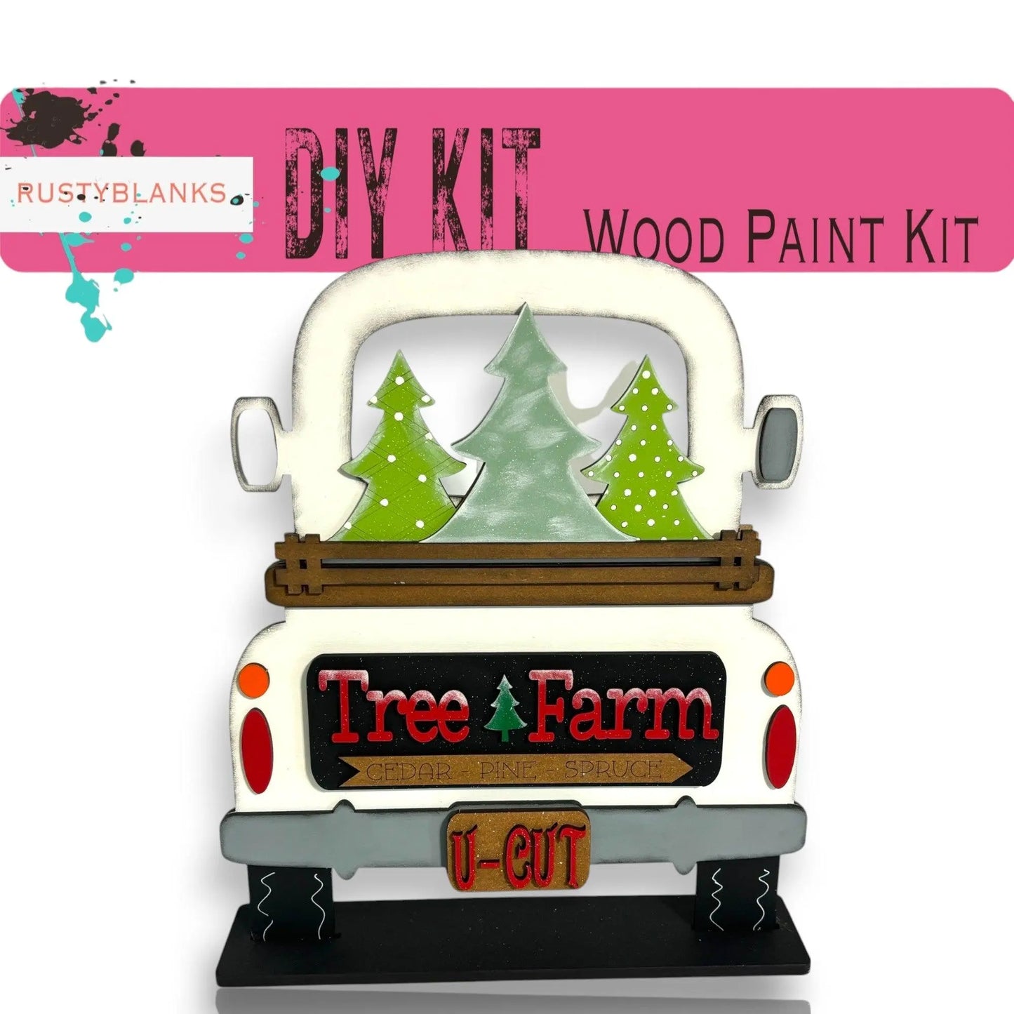 a white truck with trees on the back of it