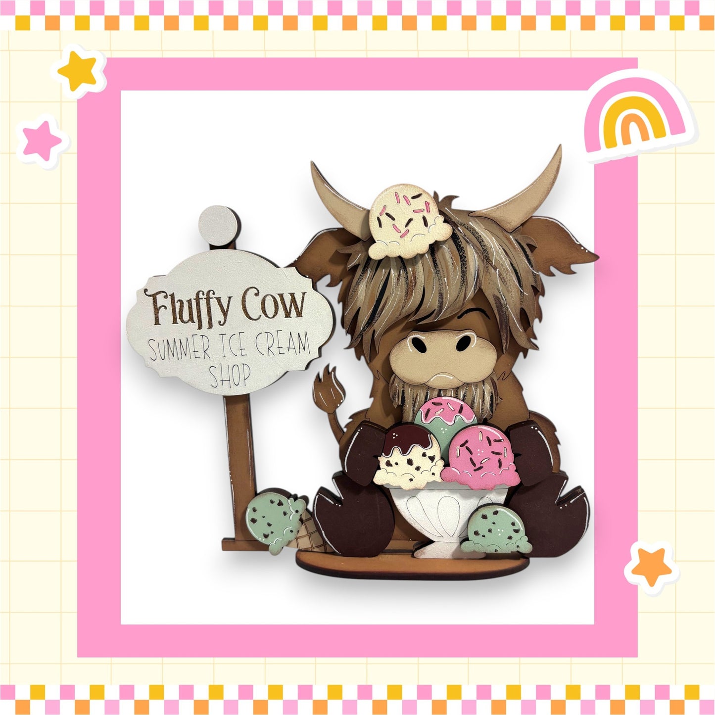 Fluffy Cow, a wooden cow figurine, is sitting on a wooden base and holding a sign that says "Fluffy Cow Summer Ice Cream Shop".