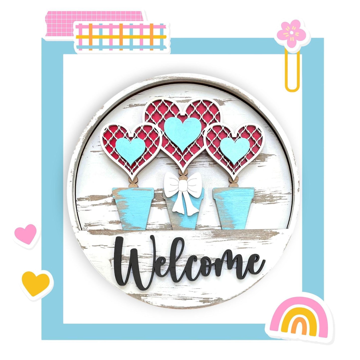a picture of a welcome sign with hearts