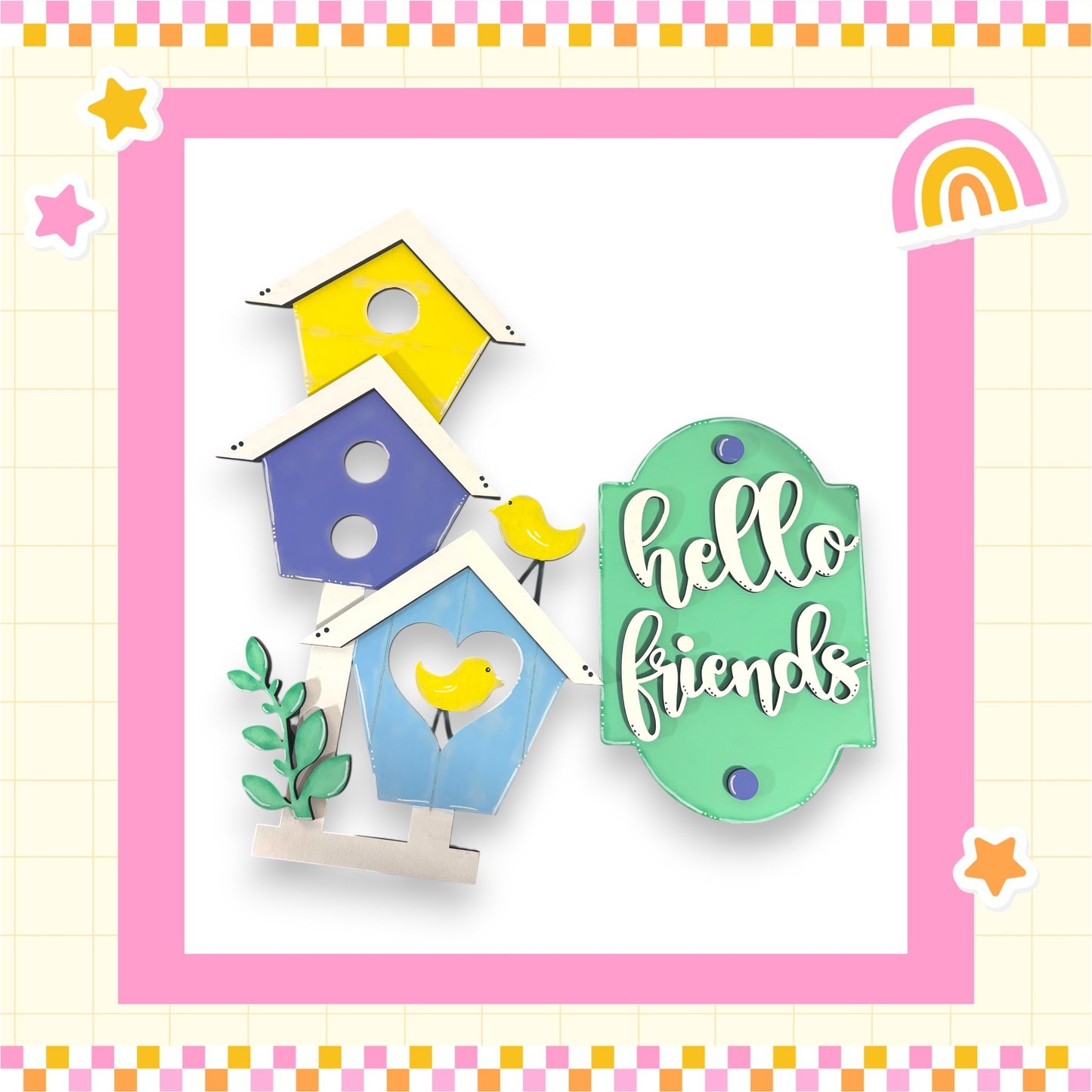A colorful and whimsical arrangement of birdhouses, with a sign that says "Hello friends" in the foreground.