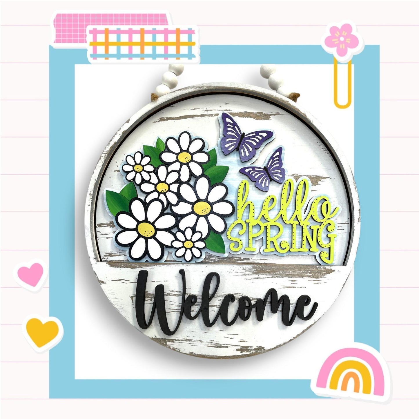 a picture of a welcome sign with flowers and butterflies