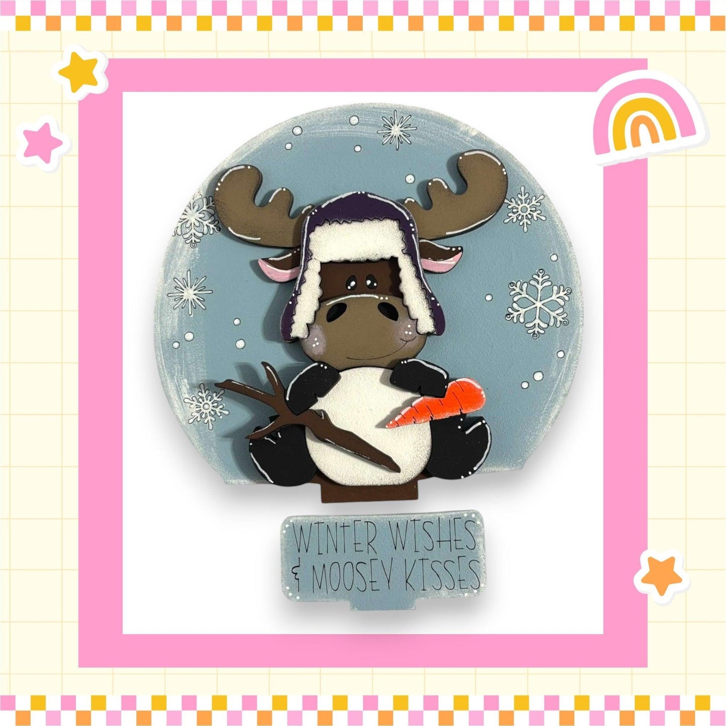 a picture of a moose wearing a hat and holding a carrot