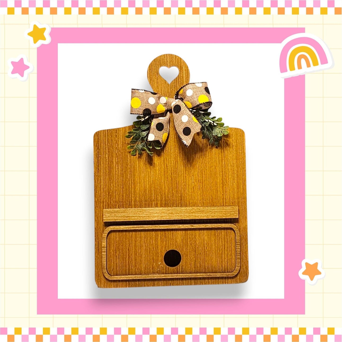 a wooden box with a bow on top of it