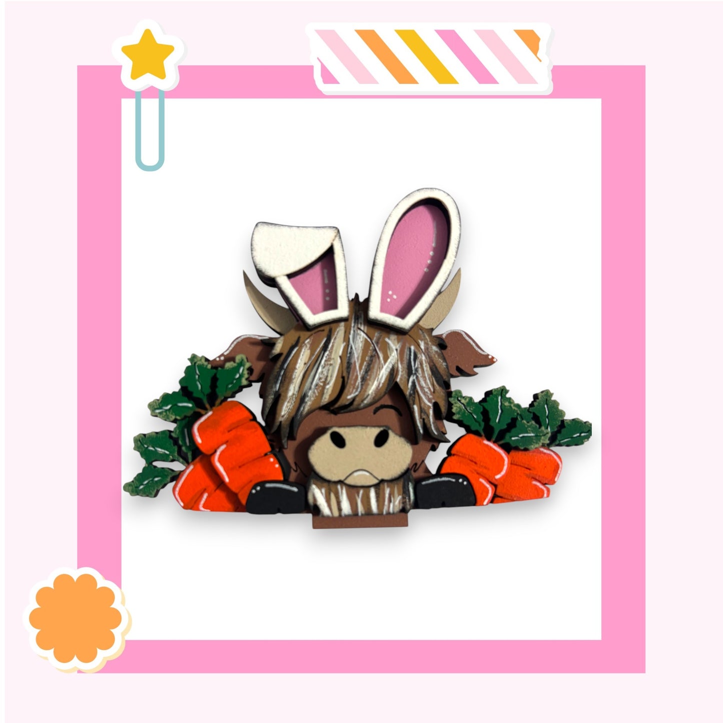 A cartoon rabbit wearing a pair of bunny ears and holding carrots, set against a pink background with a star decoration.