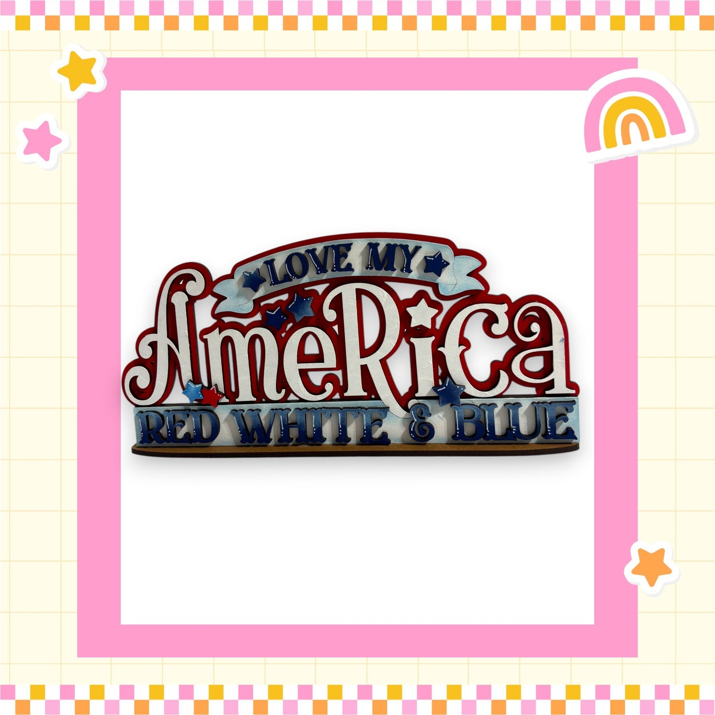 a colorful and playful design with the text "LOVE MY AMERICA RED WHITE & BLUE" prominently displayed. The design is framed by a pink border and includes various decorative elements such as stars and a rainbow.