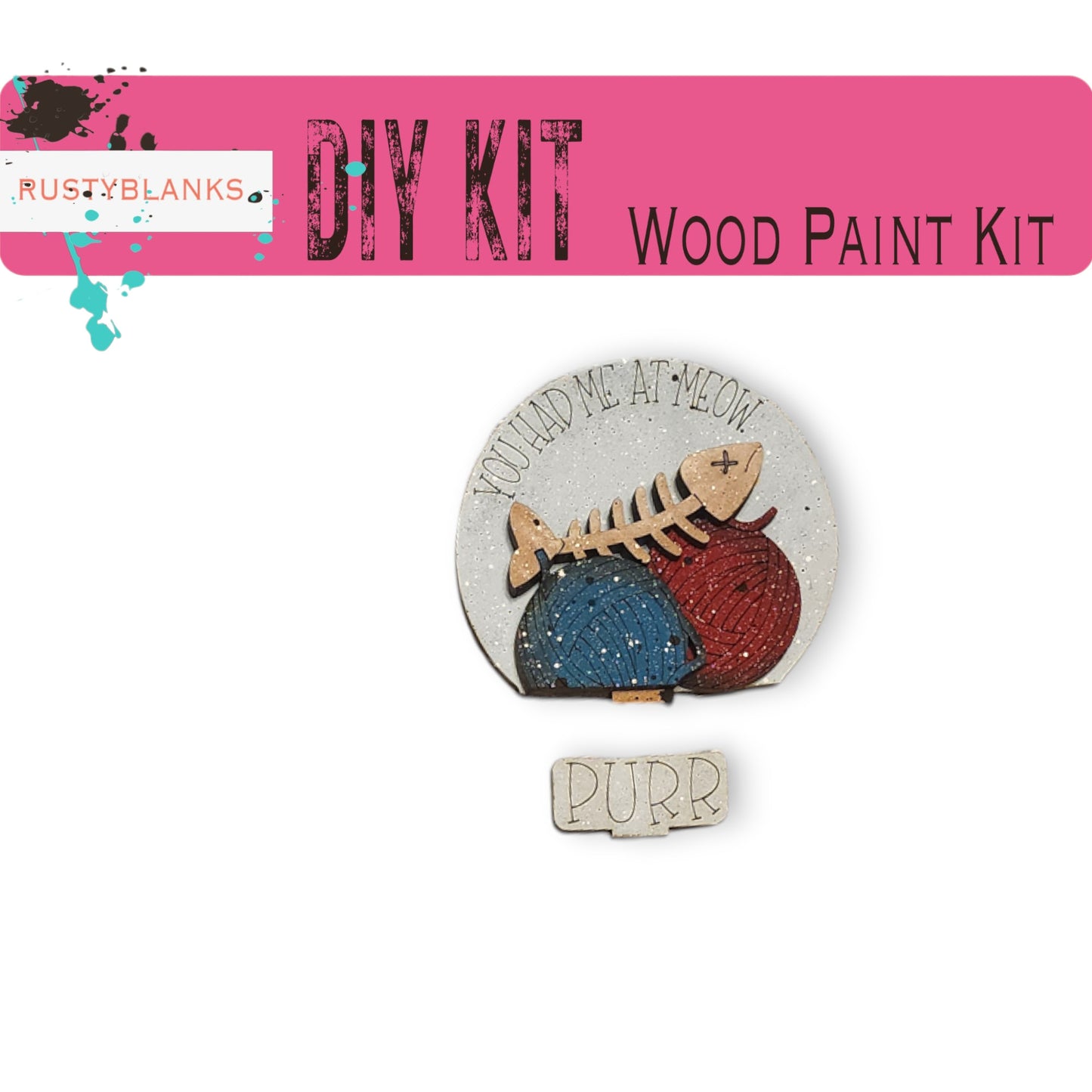 The image is a pink banner with the text "DIY KIT" and "WOOD PAINT KIT" written on it. Below the banner, there is a wooden cat figurine with a bone-like design. The cat figurine is surrounded by a red and blue ball. The phrase "YOU HAD ME AT MEOW" is written on the cat figurine.