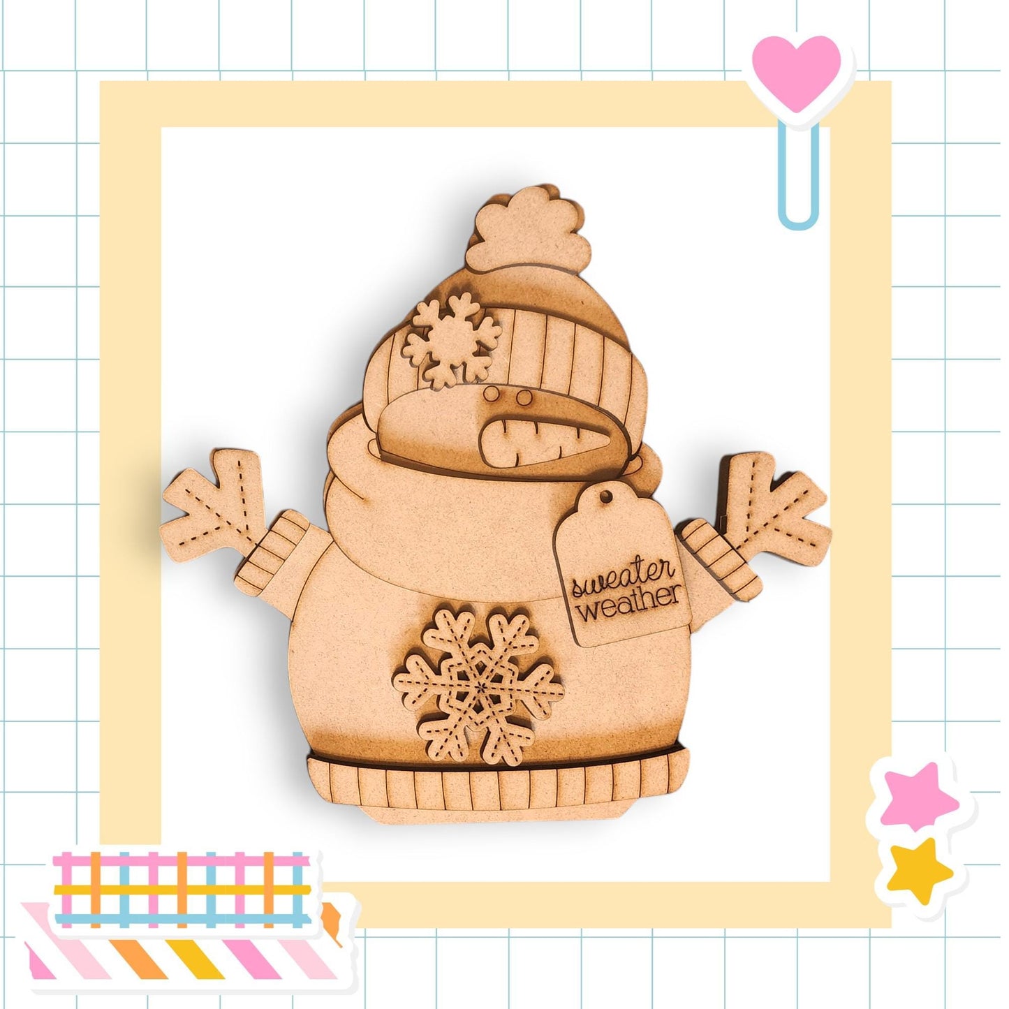 A wooden snowman figure wearing a winter hat and scarf, with a snowflake design on its chest, is the central focus of the image.