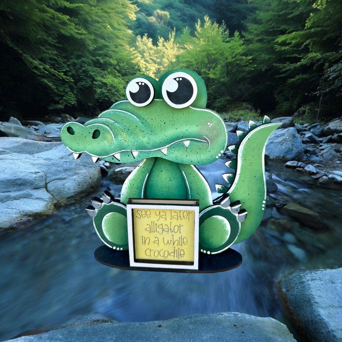 a paper cut out of a green dragon holding a sign