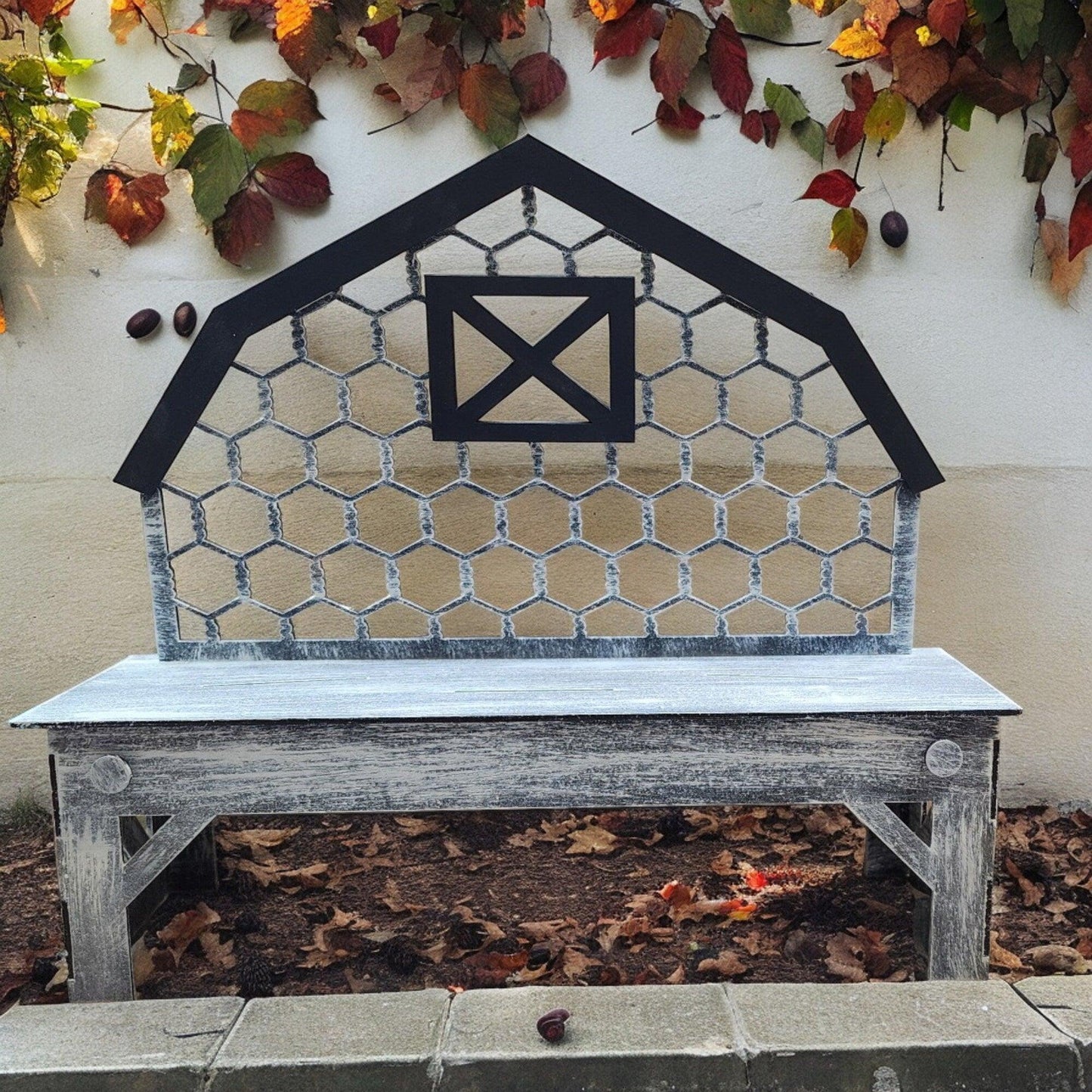 a wooden bench sitting in front of a building