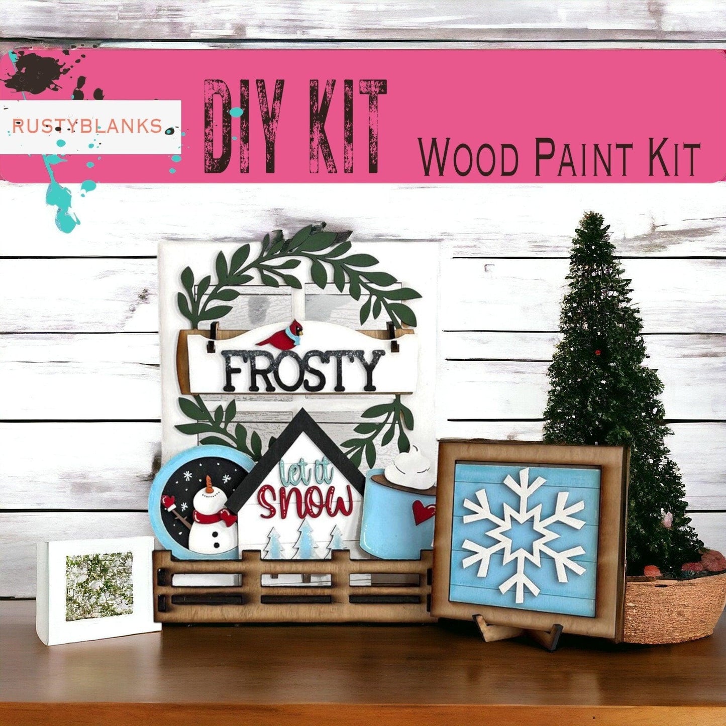 a wooden table topped with pictures and a christmas tree