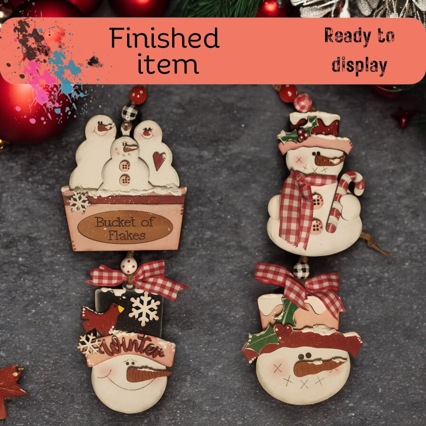 a group of snowmen hanging from a christmas tree