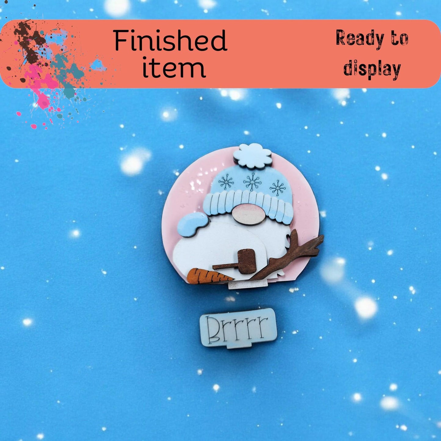 a brooch with a picture of a sheep on it