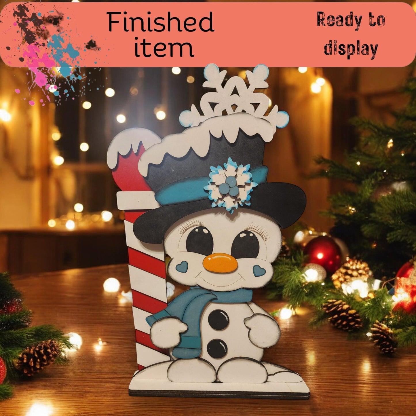 a snowman with a hat and scarf on