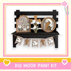 a DIY wood paint kit for creating a wooden bench with decorative elements such as a cross, flowers, and a banner.
