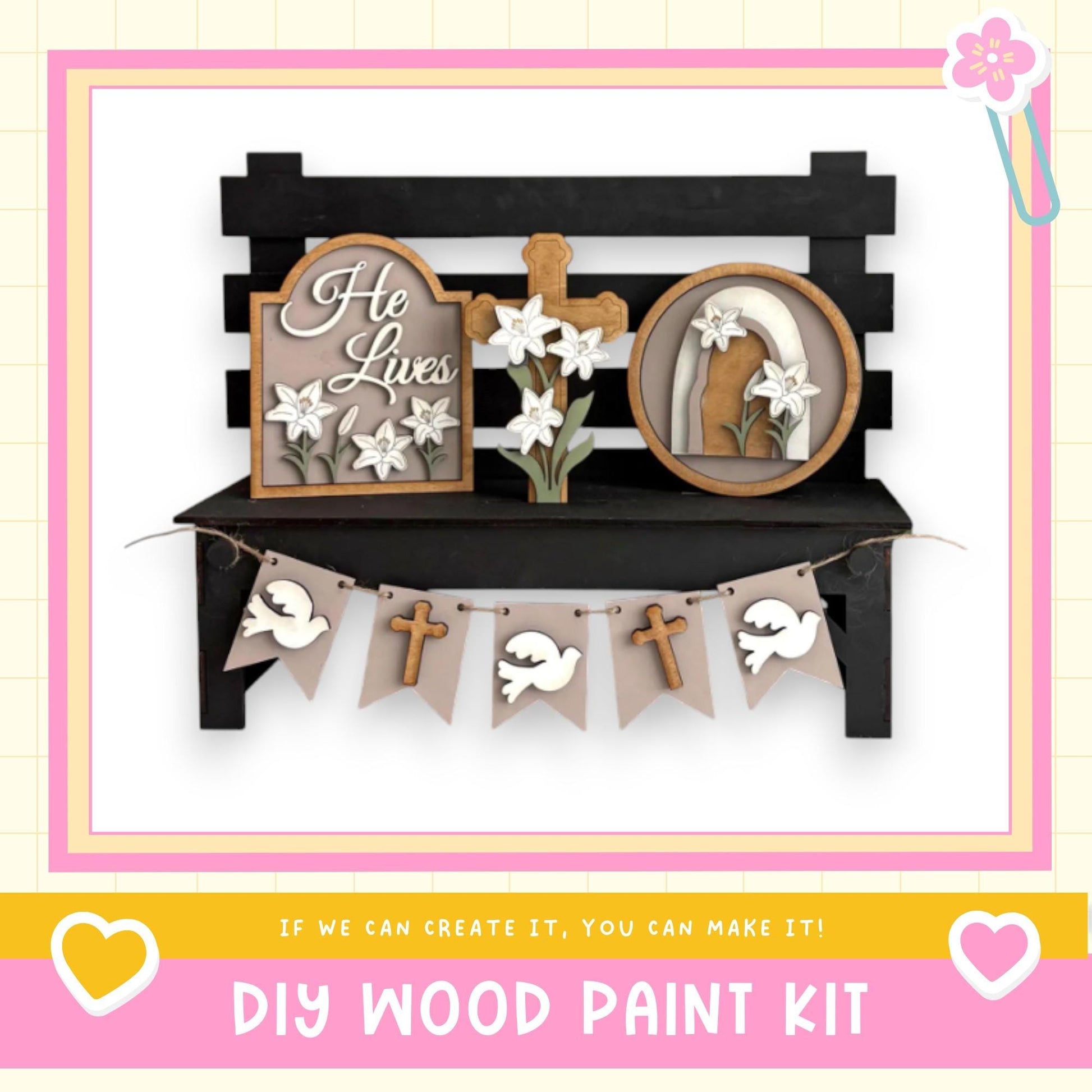 a DIY wood paint kit for creating a wooden bench with decorative elements such as a cross, flowers, and a banner.