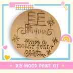 a DIY wood paint kit for creating a wooden ornament with a Christmas message.