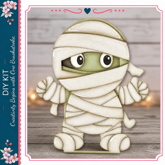 A cartoon-like character resembling a mummified figure, with a white cloth wrapped around its body and large eyes, is standing on a wooden surface.