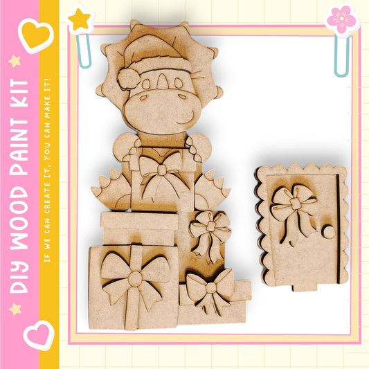 a wooden craft kit with a cute cartoon character, likely a Santa Claus or Christmas-themed character, made of wood. The kit includes various wooden shapes and decorations, such as bows and presents, which can be used to create a festive holiday-themed decoration or gift.
