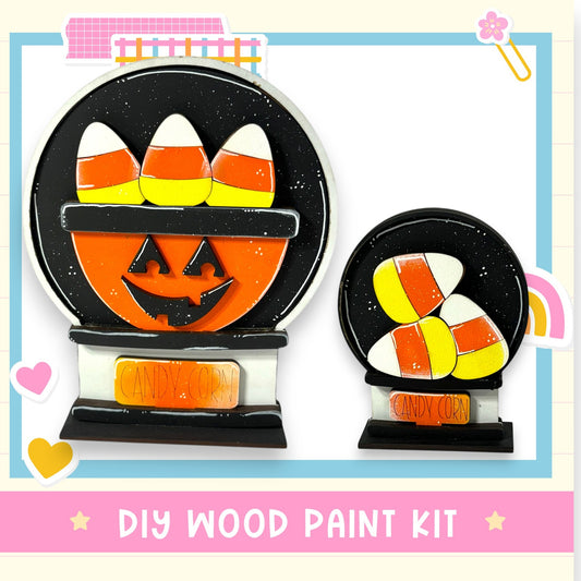 a DIY wood paint kit for creating Halloween-themed decorations, including a carved pumpkin and candy corn.