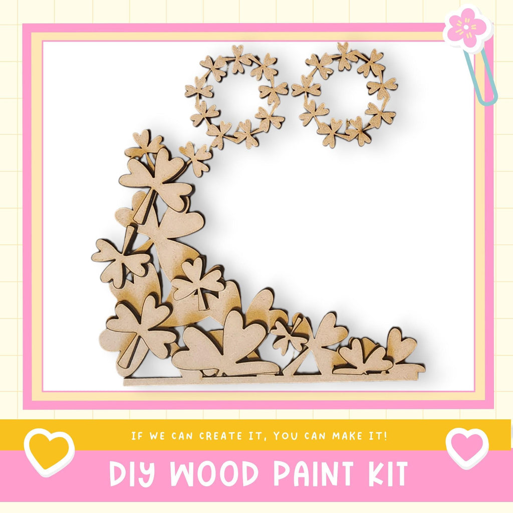 The image is a DIY wood paint kit advertisement, featuring a wooden flower-shaped design made of small wooden pieces.