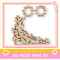 The image is a DIY wood paint kit advertisement, featuring a wooden flower-shaped design made of small wooden pieces.