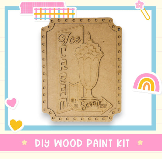 a wooden cutout of a drink with a rainbow in the background