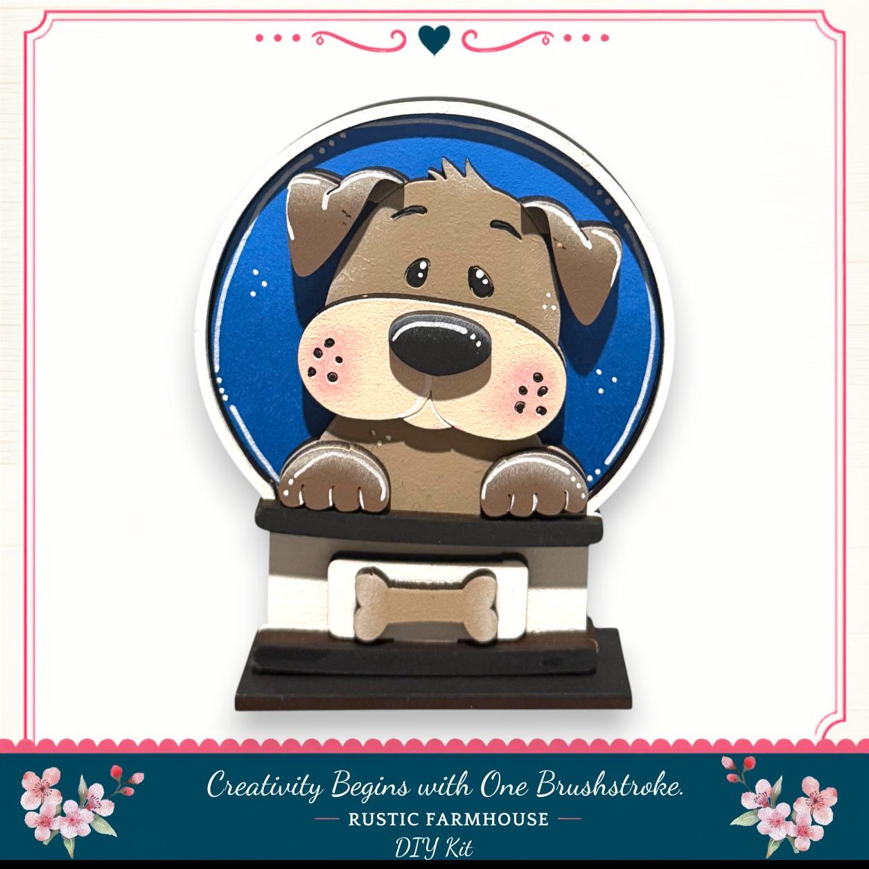 A wooden snow globe featuring a cartoon dog peeking out from the top, with a bone decoration on the base.