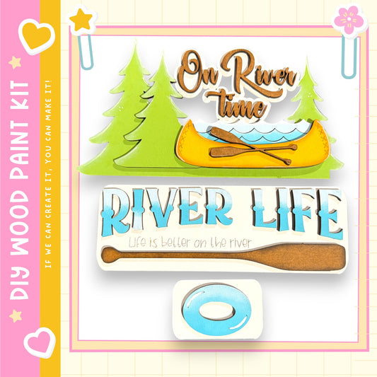 The image is a colorful and playful representation of a river life kit, featuring a canoe, trees, and a paddle. The kit appears to be designed for children, as indicated by the text "My Wood Paint Kit" and "If we can create it, we can make it." The kit is described as a "DIY" (Do It Yourself) project, suggesting that it is a kit for creating a river life scene. The kit is presented in a vibrant and cheerful manner, with the colors and design elements creating a sense of fun and excitement.