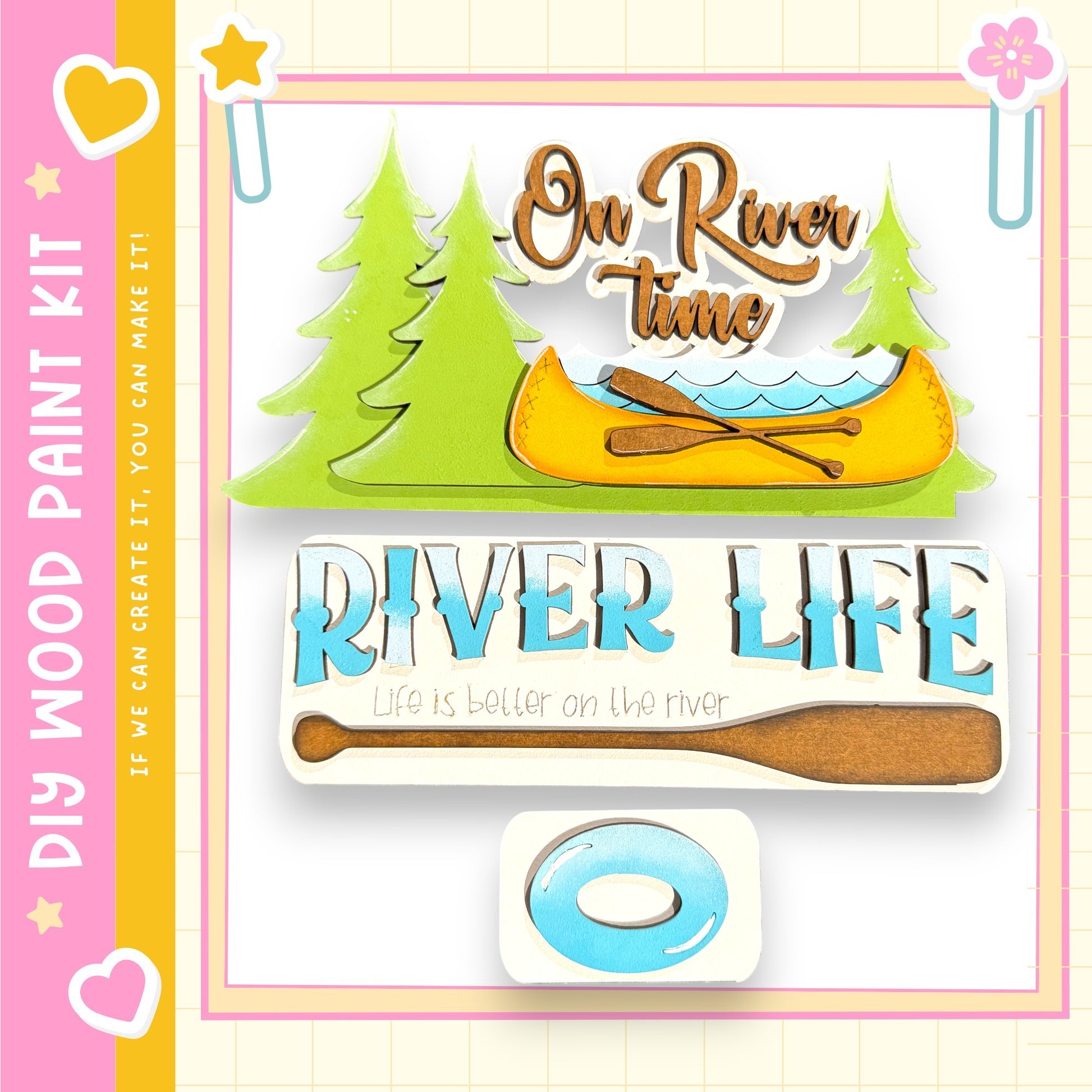 The image is a colorful and playful representation of a river life kit, featuring a canoe, trees, and a paddle. The kit appears to be designed for children, as indicated by the text "My Wood Paint Kit" and "If we can create it, we can make it." The kit is described as a "DIY" (Do It Yourself) project, suggesting that it is a kit for creating a river life scene. The kit is presented in a vibrant and cheerful manner, with the colors and design elements creating a sense of fun and excitement.