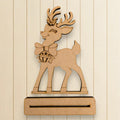 A wooden deer figure with antlers and a bow tie is displayed against a white background.